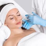 Woman closes her eyes peacefully during a liquid facelift