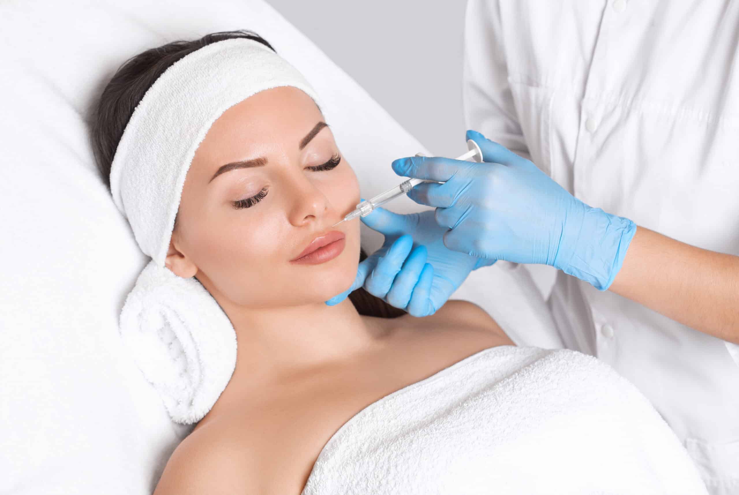 Woman closes her eyes peacefully during a liquid facelift