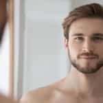 Man with defined jawline and refreshed facial appearance after male facelift.